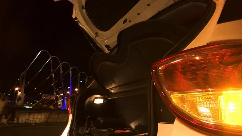 CAR TRUNK OPENED NIGHT Stock Footage 92910986
