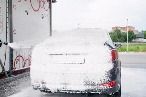 Car trunk in soapy foam from a detergent Stock Photos