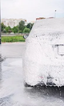 Car trunk in soapy foam from a detergent Stock Photos