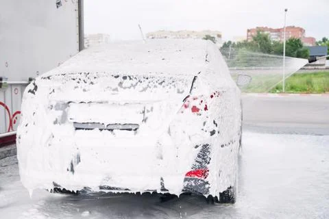 Car trunk in soapy foam from a detergent Stock Photos