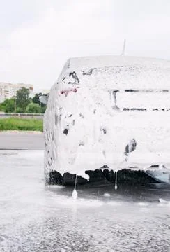 Car trunk in soapy foam from a detergent Stock Photos