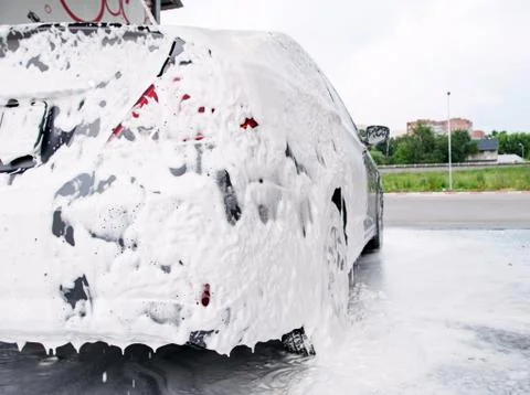 Car trunk in soapy foam from a detergent Stock Photos