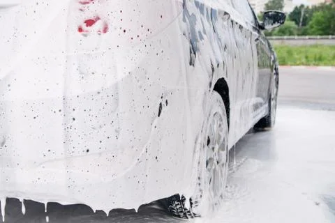 Car trunk in soapy foam from a detergent Stock Photos