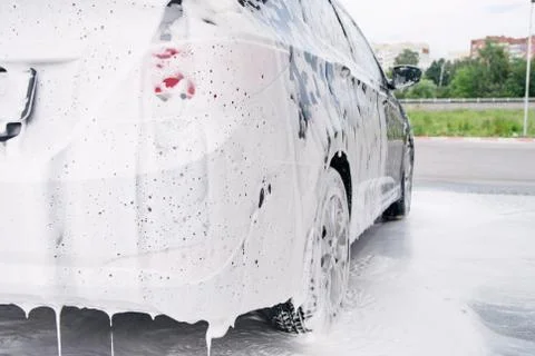 Car trunk in soapy foam from a detergent Stock Photos