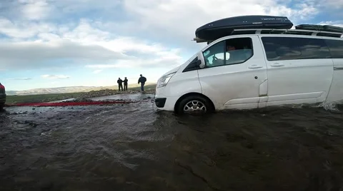 Car is Trying to Pull Another Car Out of Pond in Highland Stock Footage 60580944