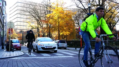 The car before the turn skips cyclists Stock Footage 93217946