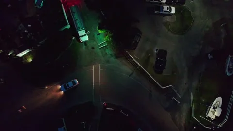 Car Turning Corner at night overhead 動画素材 157879466