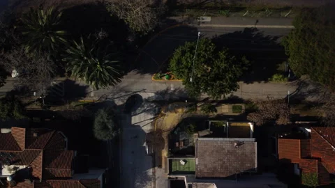 The car turns around at an empty intersection and leaves, top view, Stock Footage 247977947