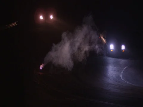 Car Turns Next To Burning Object At Night Stock Footage 82265592
