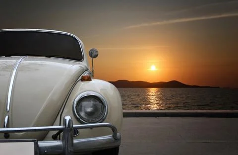 Car turtles old version of classic car parked on wave protection. Stock Photos