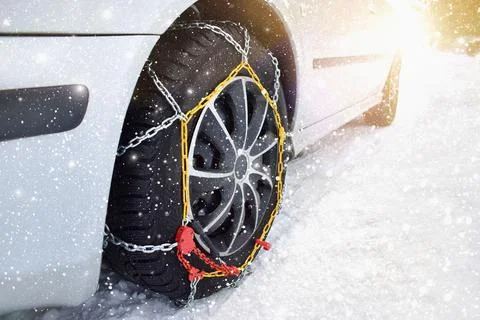 Car with tyre chains in winter Stock Photos