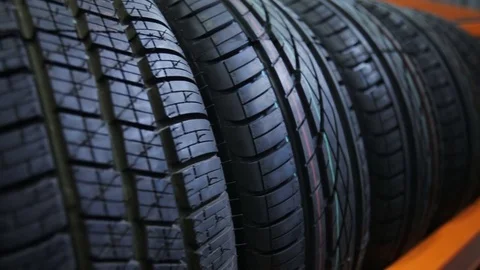 Car tyres at store Stock Footage 69999348