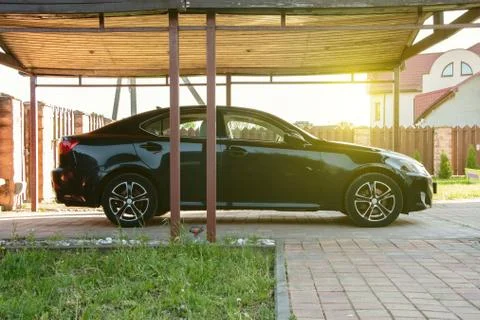 The car is under a canopy, an open garage 写真素材