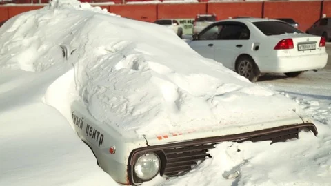 Car under a snowdrift Stock Footage 73634392