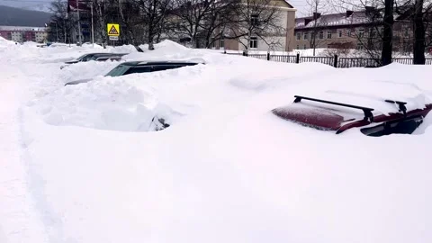 Car under thick blanket of snow after storm. Vehicles buried under ice. Nobody Stock Footage 263006501