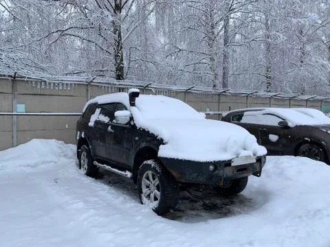Car under a thick layer of snow Stock Photos