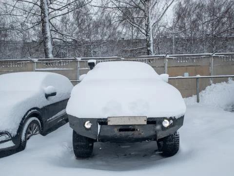 Car under a thick layer of snow Stock Photos