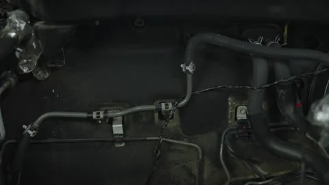 Car vacuum hose lines connected with clips inside engine bay Stock Footage 340273097