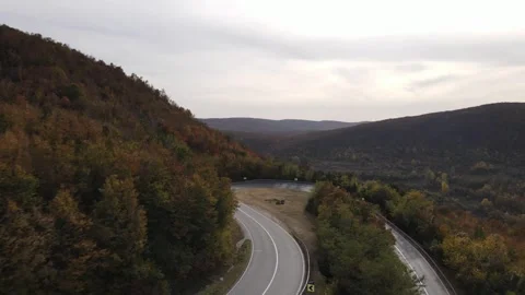 Car vehicle drive on mountain range nature aerial view in autumn day Stock Footage 254022632