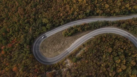 Car vehicle drive on mountain range nature aerial view in autumn day Stock Footage 254022759