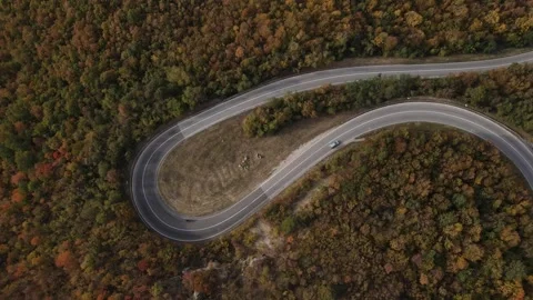 Car vehicle drive on mountain range nature aerial view in autumn day Stock Footage 254022825