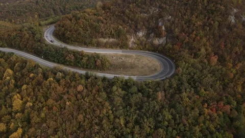 Car vehicle drive on mountain range nature aerial view in autumn day Stock Footage 254022991
