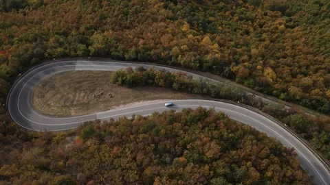 Car vehicle drive on mountain range nature aerial view in autumn day Stock Footage 254023138