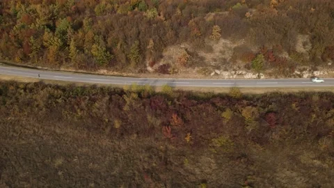 Car vehicle drive on mountain range nature aerial view in autumn day Stock Footage 254023431