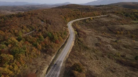 Car vehicle drive on mountain range nature aerial view in autumn day Stock Footage 254023466