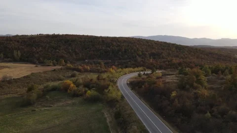 Car vehicle drive on mountain range nature aerial view in autumn day Stock Footage 254023791