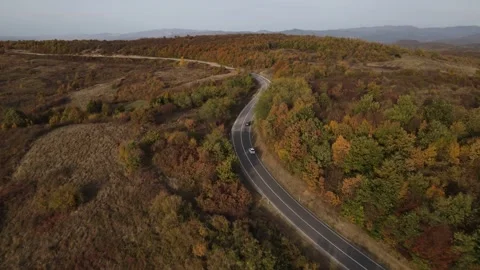 Car vehicle drive on mountain range nature aerial view in autumn day Stock Footage 254023837