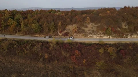 Car vehicle drive on mountain range nature aerial view in autumn day Stock Footage 254023942
