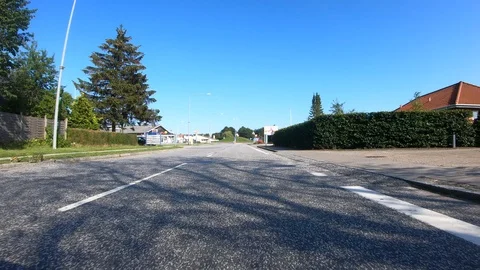 Car View Driving Forward in Small City 4K Road Summer Travel Adventure GoPro Stock Footage 113070463