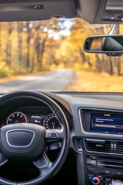 Car view from the inside. Car steering wheel and interior. Stock Photos