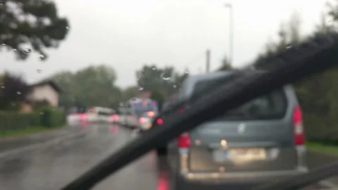 Car waiting in rush hour traffic on a rainy day. Stock Footage 150466261
