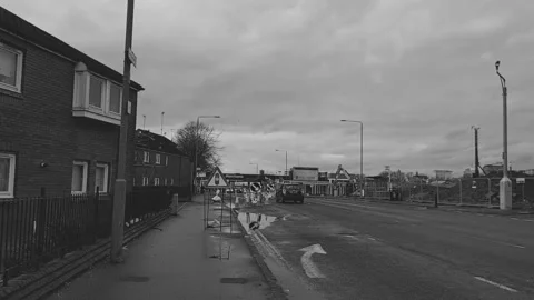 A car waiting at a set of temporary traffic light Stock Footage 171835520