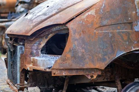 The car was completely destroyed by fire. Abandoned, burnt and rusty car by t 写真素材