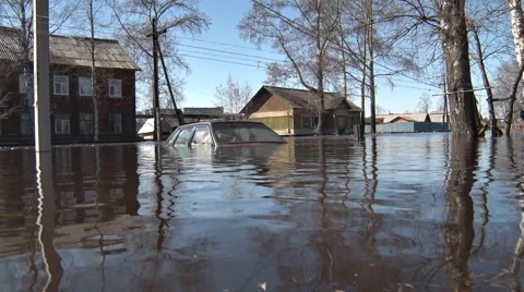 Car was flooded with water during spring flooding in village Stock Footage