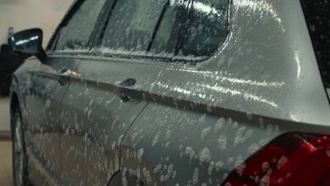 Car wash. Auto covered with cleaning foam Stock Footage 146815134