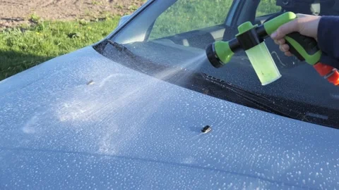 Car wash close-up. the driver washes the car Stock Footage 154420249