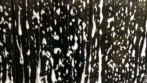 Car wash foam bubbles on black cars Stock Footage 147242704