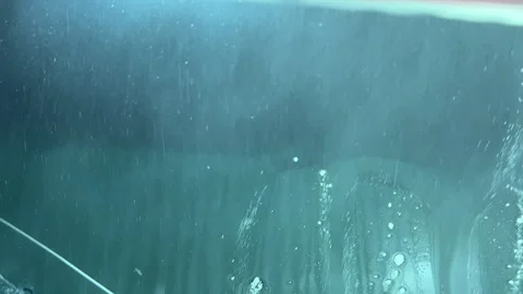 Car wash, foam drips down the glass Stock Footage 305498983