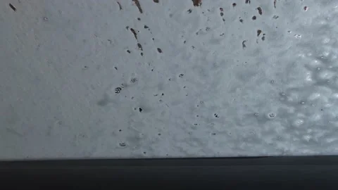 Car wash inside view. Foam application on the windshield, vehicle cleaning. Stock Footage 156056827