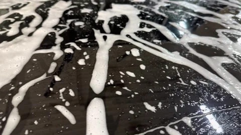 Car washer does full body car wash with soap. Stock Footage 321239400