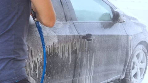 Car washing Cleaning car using high pressure water Contactless self-service Stock Footage 156750323