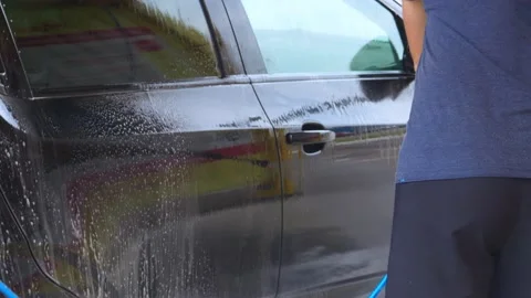 Car washing Cleaning car using high pressure water Contactless self-service Stock Footage 156750333
