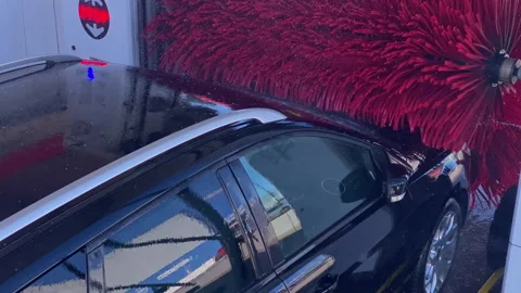 Car washing inside automatic vehicle cleaning service Stock Footage 333038255