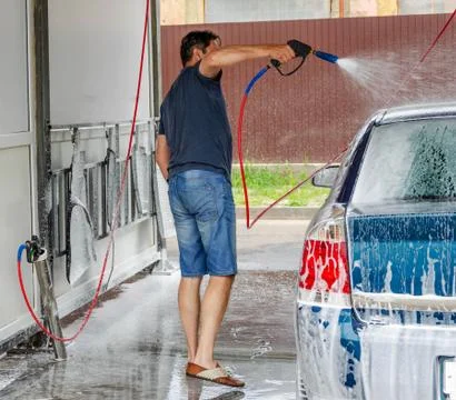 Car washing using high pressure water. Stock Photos