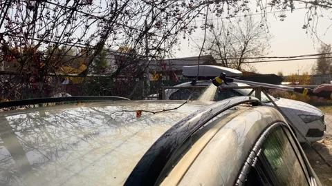 Car washing using an outdoor spray gun Stock Footage 319953066