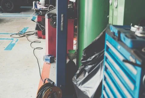 Car wheel balancing machine for spining tyre to balance weight in auto repair Stock Photos